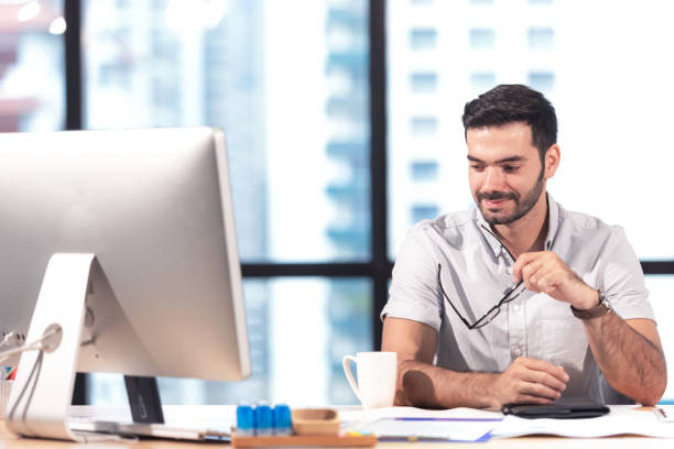 istock Businessman caucasian using  computer to work with financial data in the modern office, 1170514526