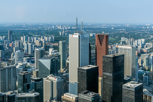 Toronto City, Ontario, Canada - 6 Aug 2019 -  Aerial view of Toronto City Skyscrapers, Looking northeast from top of CN Tower toward East York and Scarborough districts in summer, Union Station at bottom right. Toronto City, Ontario, Canada
