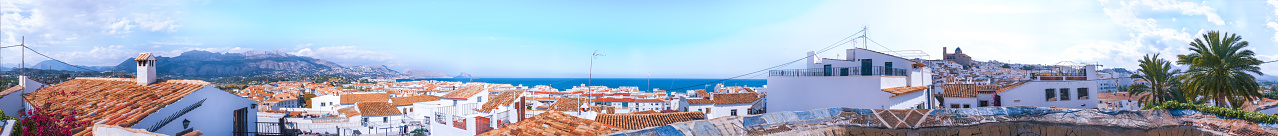 Panorama of the Spanish Mediterranean town Altea. White houses with red tiled roofs on the shores of the azure sea. Costa Blanca Coast, province of Alicante, Valencian Community, Spain, Apr.2019