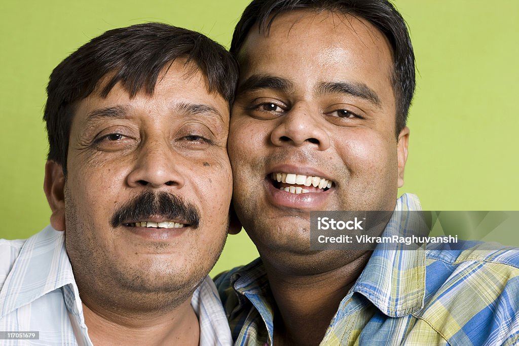 Two Funny Cheerful Indian Male Friends Joining Cheeks Stock Photo -  Download Image Now - iStock