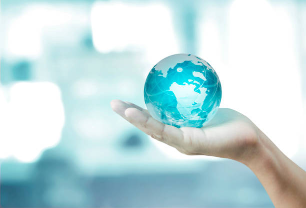 istock Globe ,earth in hand, holding our planet  glowing. Earth image provided by Nasa 1170519254