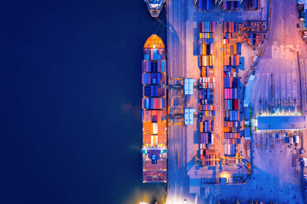 istock Aerial view of business port with shore crane loading container in container ship in import/export and business logistics with crane and shipping port cargo.International transportation concept. 1170520847