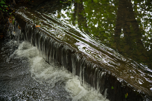 A small waterfall section in Cornish woodland in summer