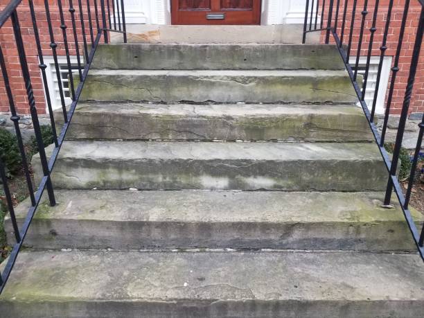 istock cement stairs with metal railing and red brick building 1170521571