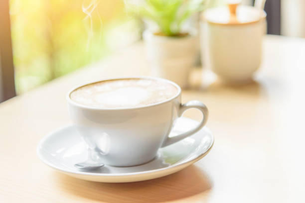 istock hot coffee on table / hot cappuccino with nice pattern milk foam 1170521602