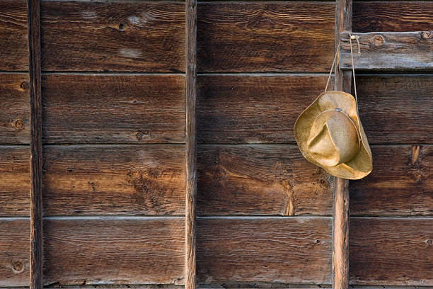 istock straw cowboy hat and weathered wood 117052293