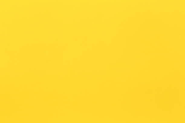 istock surface of yellow art paper background. 1170524917