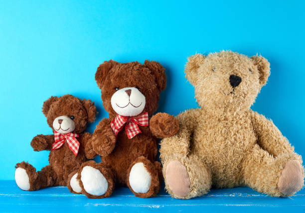 istock teddy bears on a blue background, friendship concept 1170525707