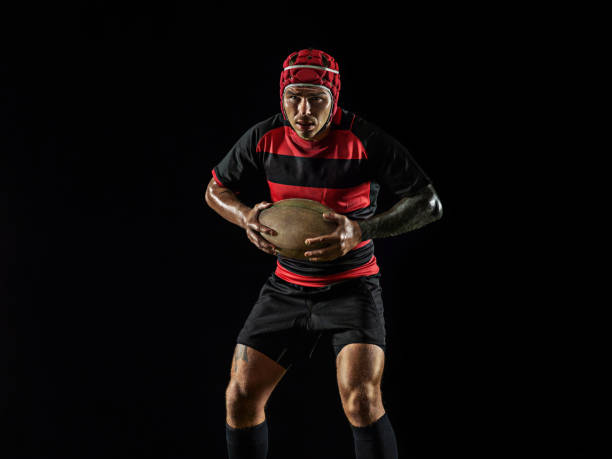 istock One caucasian man playing rugby on black background in mixed light 1170525902