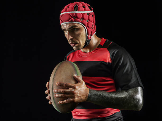 istock One caucasian man playing rugby on black background in mixed light 1170525903