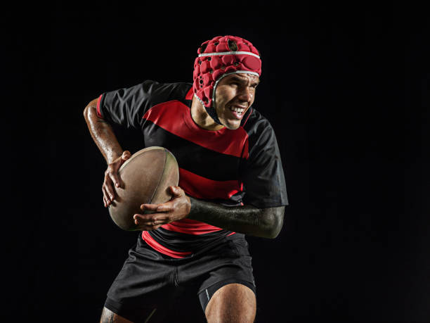 istock One caucasian man playing rugby on black background in mixed light 1170525909