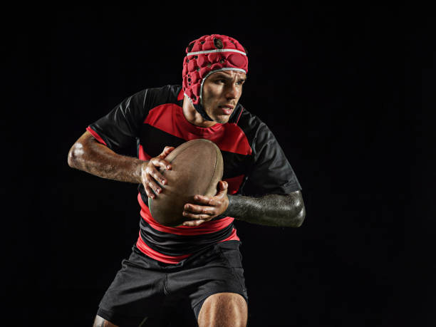 istock One caucasian man playing rugby on black background in mixed light 1170525912