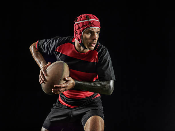 istock One caucasian man playing rugby on black background in mixed light 1170525918