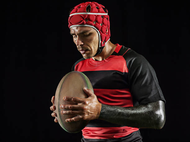 istock One caucasian man playing rugby on black background in mixed light 1170525922