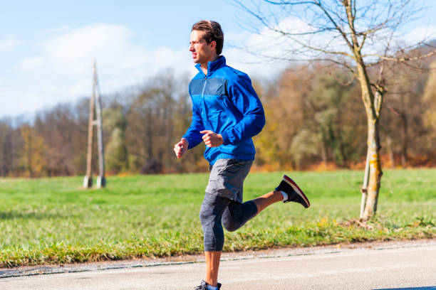 istock Young man jogging on a sunny day 1170527180