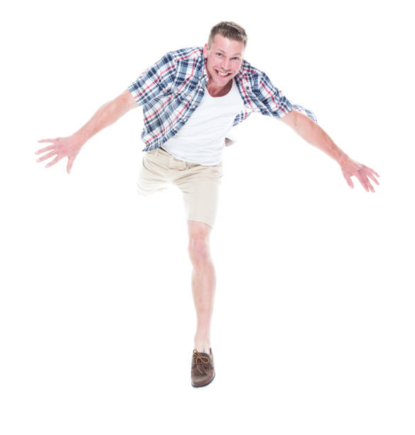 istock Handsome man in shirt and shorts is jumping 1170528187