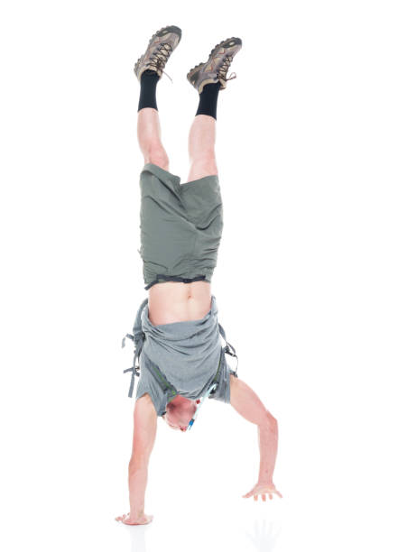 istock Friendly male hiker is doing a handstand 1170530331