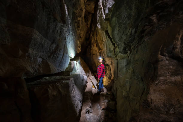 istock Girl in a Cave 1170530505