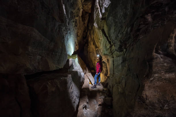 istock Girl in a Cave 1170530581