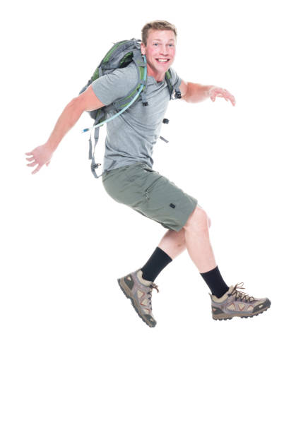istock Friendly male hiker is jumping with excitement, side view 1170530690