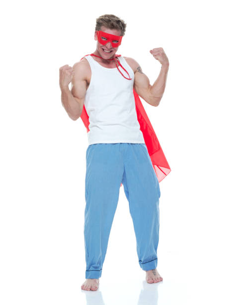 istock Man wearing pajamas and super hero cape 1170532125