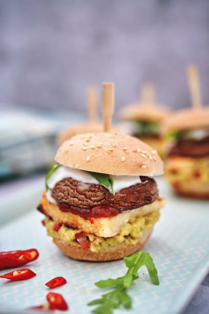istock Mini Veggie Burger with Grilled Cheese, Mushroom, Guacamole and Arugula 1170532431
