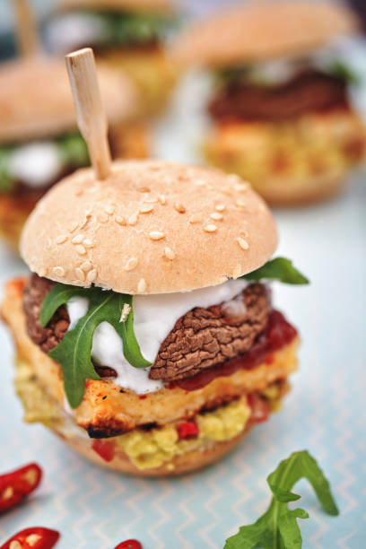 istock Mini Veggie Burger with Grilled Cheese, Mushroom, Guacamole and Arugula 1170532435