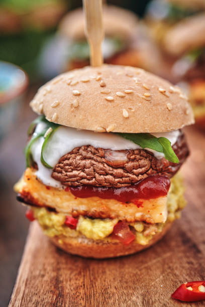 istock Mini Veggie Burger with Grilled Cheese, Mushroom, Guacamole and Arugula 1170532471