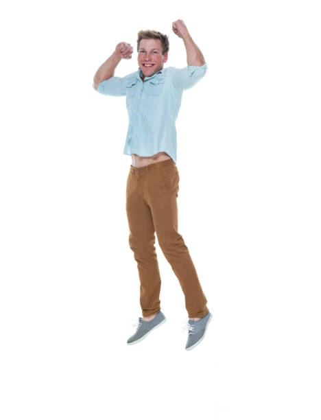 istock Casual well dressed man jumping 1170532565