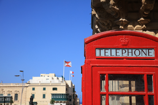 Red vintage british telephone box in the ancient city of Valletta. Malta