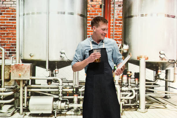 istock Brewery - Brewmaster holding beer and clipboard 1170534256
