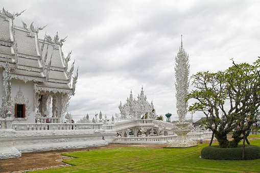 Chiang Rai, Thailand - August 04 2012: Wat Rong Khun (Thai: วัดร่องขุ่น), perhaps better known to foreigners as the White Temple, is a contemporary, unconventional Buddhist temple in Chiang Rai Province.