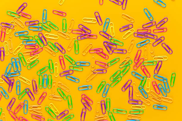 istock Paper color clip notebook on yellow background. Flat lay. 1170534625