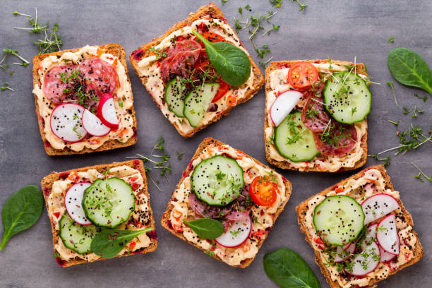 istock Sandwiches with cream cheese, vegetables and salami. 1170534831