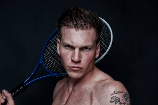 istock Sexy male tennis player 1170536071
