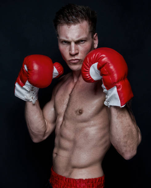 istock Sexy male boxer on black background 1170536282