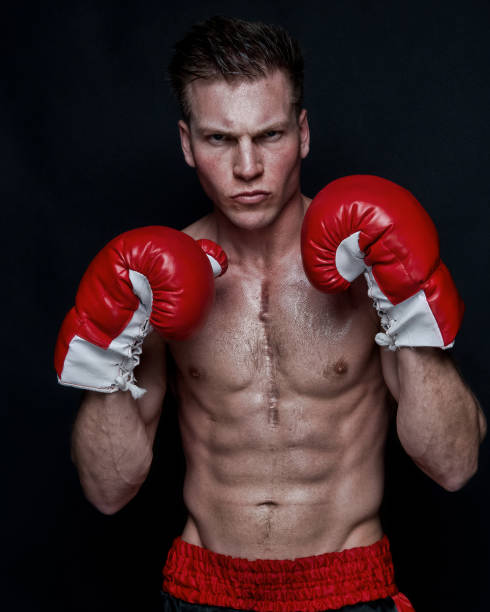 istock Sexy male boxer on black background 1170536333