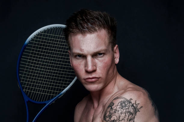 istock Sexy male tennis player 1170536338