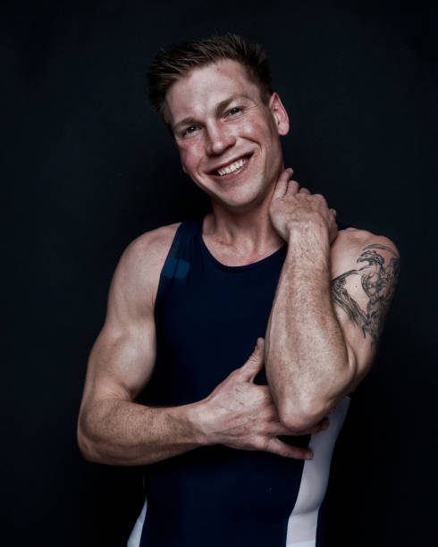 istock Sexy male wrestler on black background 1170536545