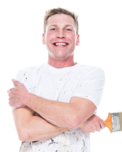 istock Handsome young white man who is a painter - arms crossed 1170536795