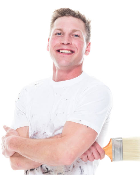 istock Young attractive male painter standing on white background - smiling 1170536909