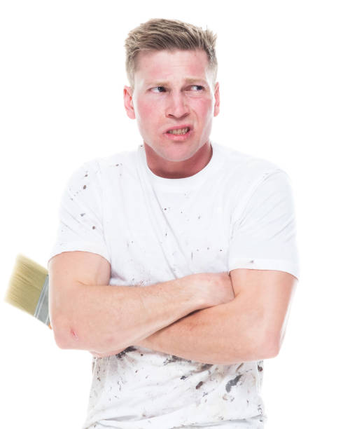 istock Young attractive male painter standing on white background - worried 1170537069