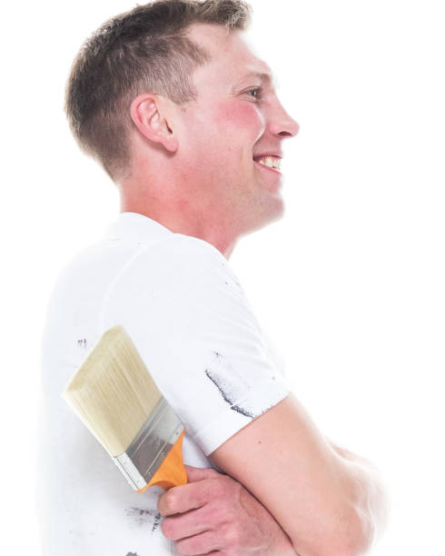 istock Handsome young white man who is a painter - arms crossed 1170537084