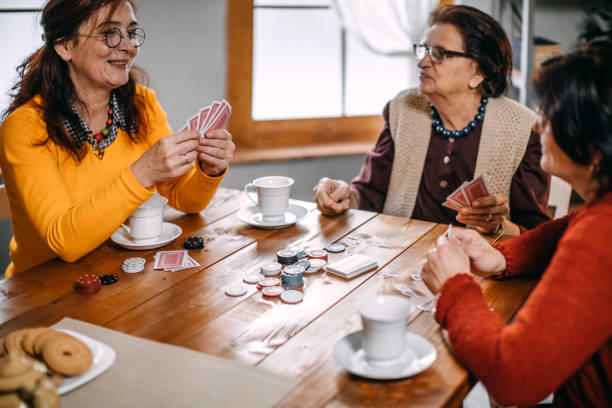 istock Active senior women playing games at home 1170538183
