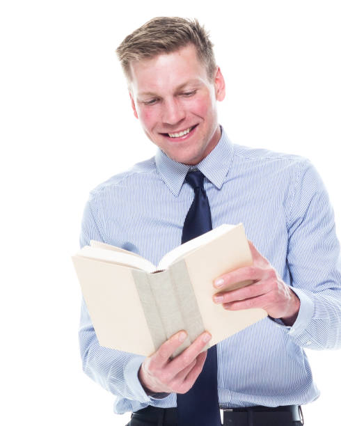 istock Handsome attractive man in business attire on white background - holding book 1170538419