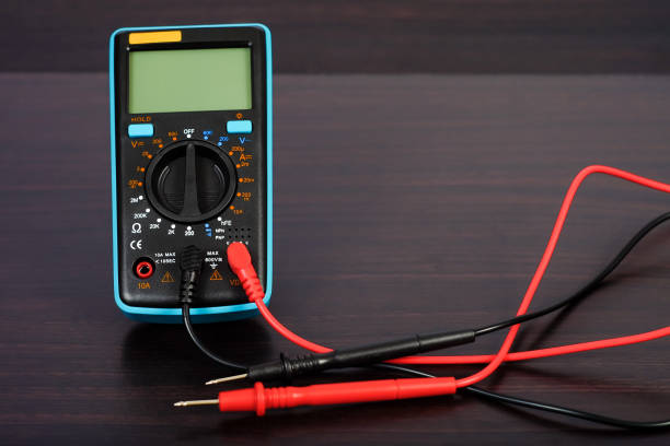 istock Digital multimeter with probes on a white background. 1170538626
