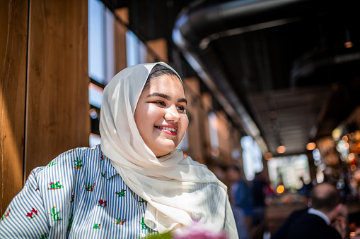 Portrait of a Muslim teenager looking away