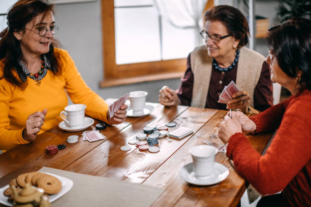 istock Active senior women playing games at home 1170540032