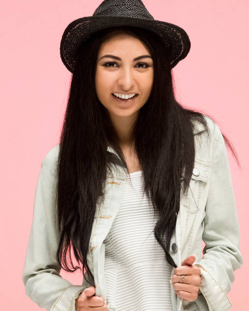istock Beautiful female on pink background is looking trendy 1170540652
