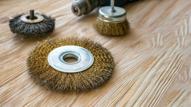 istock abrasive tools for brushing wood and giving it texture. Wire brushes on treated wood. Copy space 1170541619